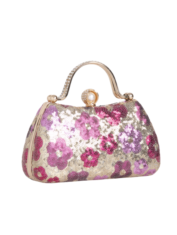 Floral patterned handbag with rhinestone handle on a white background