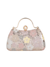 Floral patterned handbag with gold accents on a white background
