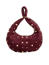 Cherry Red Suedette Studded Half Moon Bag Burgundy Handbag with handle pushed through the hoop